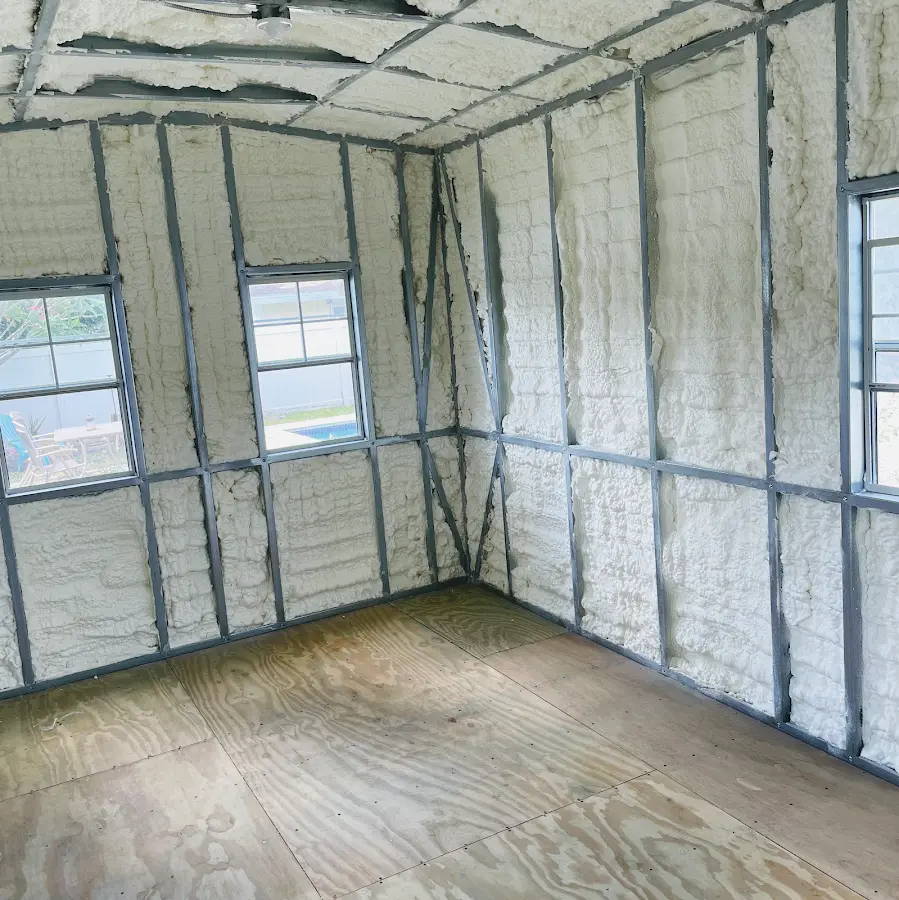Closed-cell spray foam insulation applied to wall cavities in a residential project in Auburndale